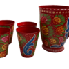 Close-up of floral and paisley patterns on red hand-painted mugs
